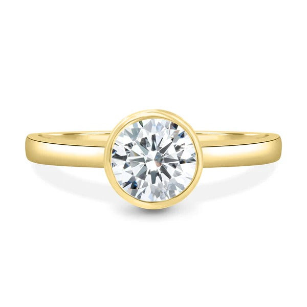 Round cut lab grown diamond bezel set ring with open gallery
