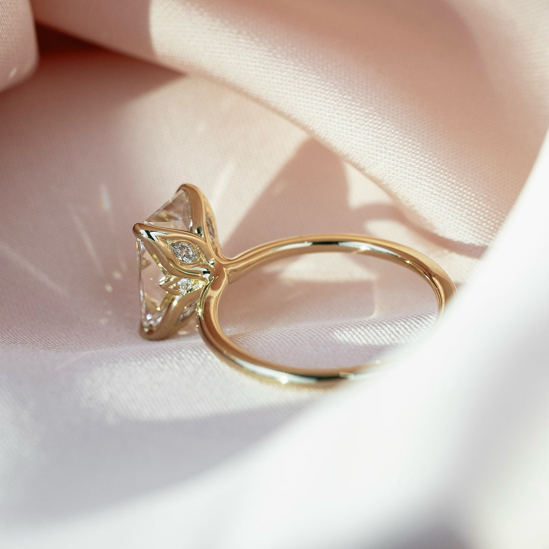 Marquise diamond accents set into the gallery of the elongated radiant ring