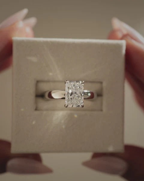 Radiant cut diamond cigar band ring side profile