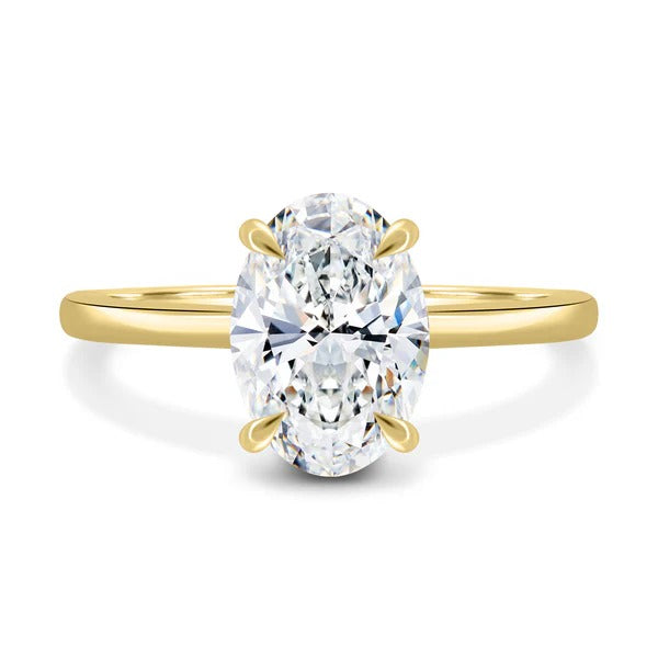 Oval cut lab grown diamond four claw solitaire ring with plain band