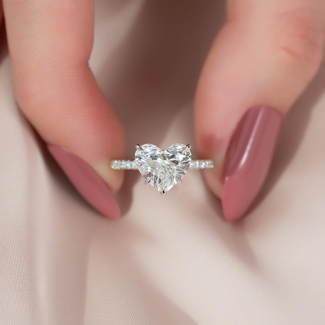 Heart cut lab grown diamond solitaire ring with pave shoulders in white gold