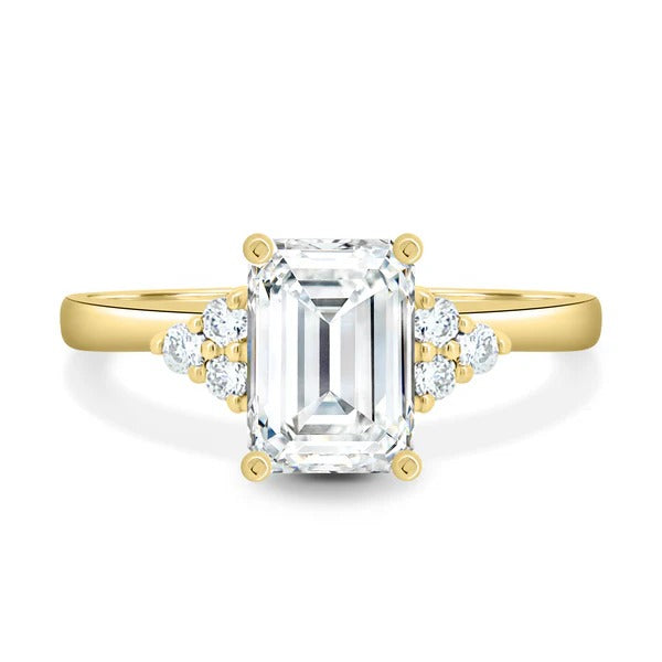 Emerald cut lab grown diamond ring with trefoil cluster accents