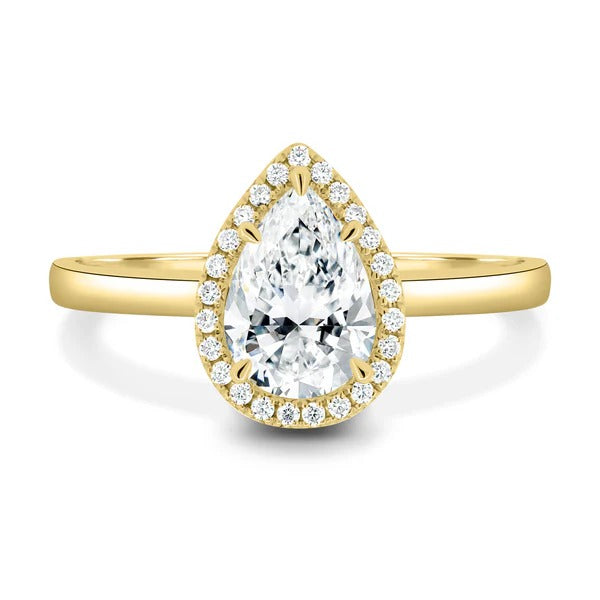 Pear cut lab grown diamond five claw halo ring on a cathedral band