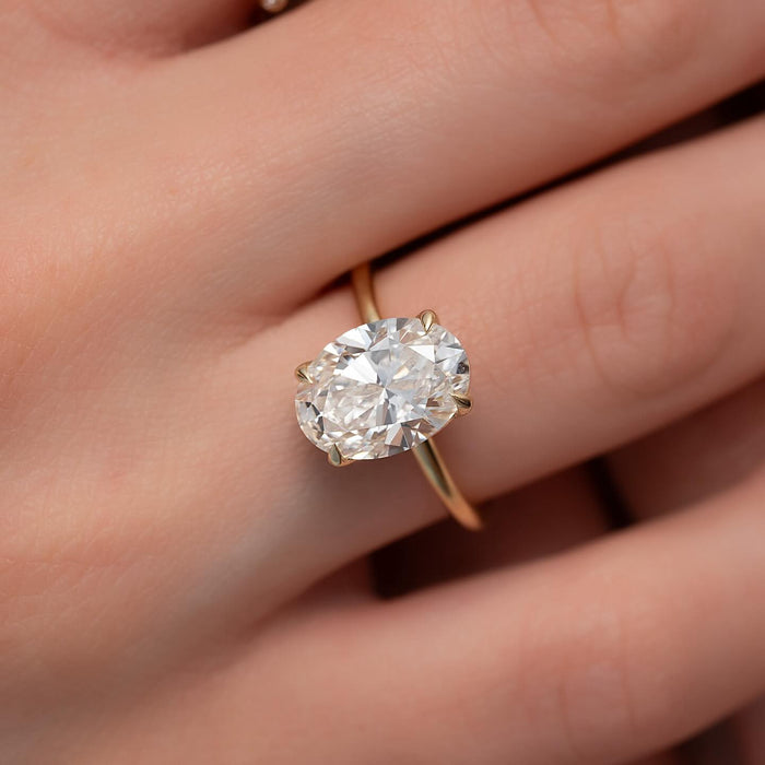Four claw setting holding the oval lab grown diamond
