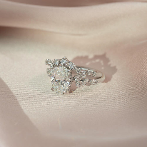 Oval cut lab grown diamond bridal set with scattered cluster bands in white gold