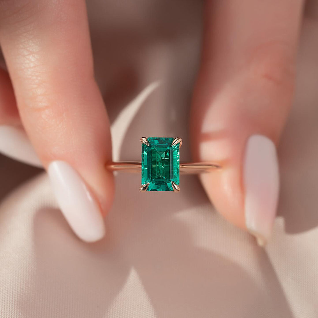 Emerald cut lab grown emerald solitaire ring in rose gold