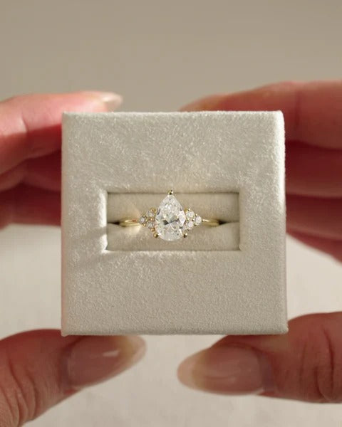 Pear cut lab grown diamond cluster accent ring in presentation box