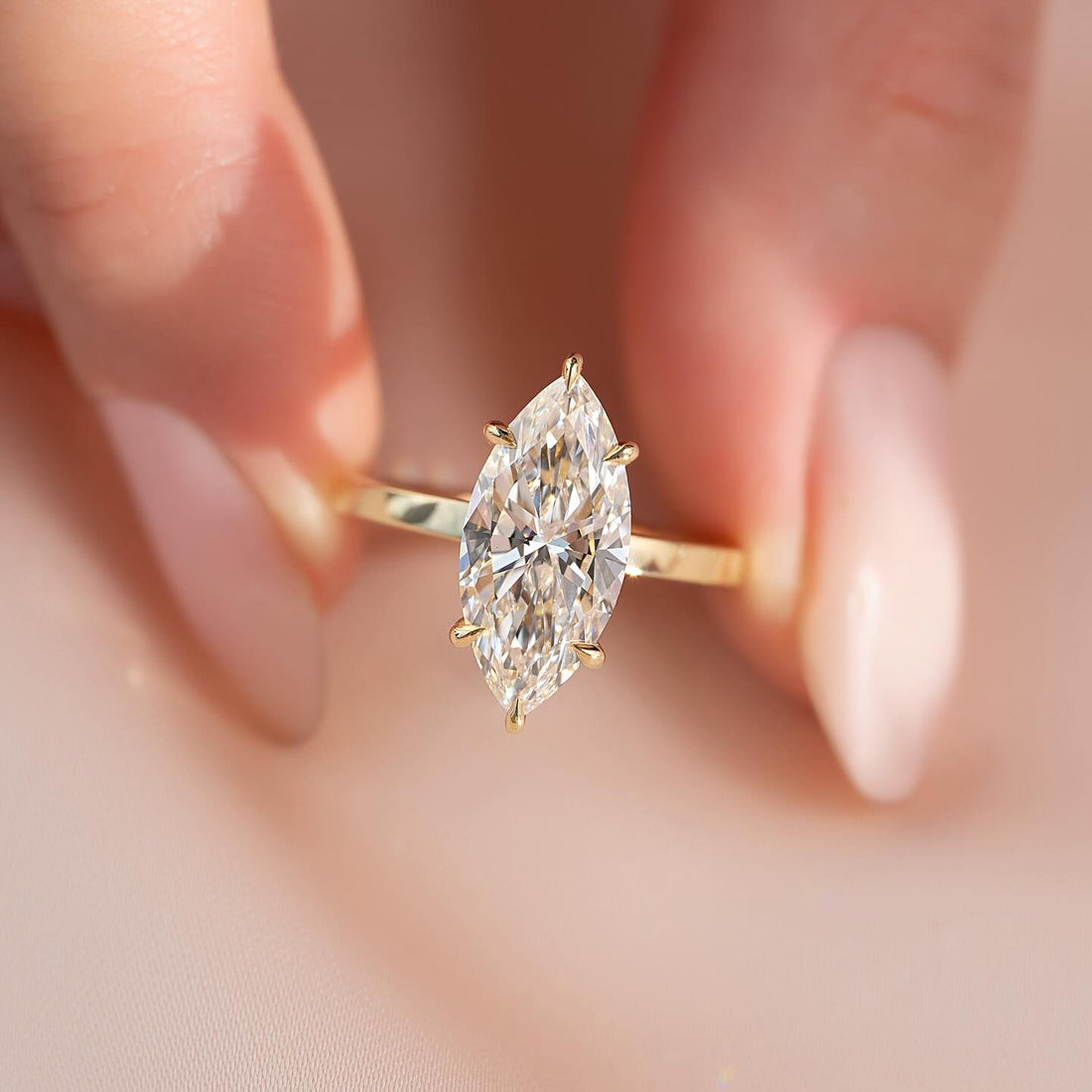 Marquise cut lab grown diamond solitaire ring in yellow gold with slim flat band