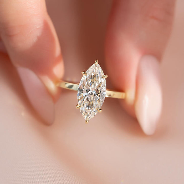Marquise cut lab grown diamond solitaire ring in yellow gold with slim flat band