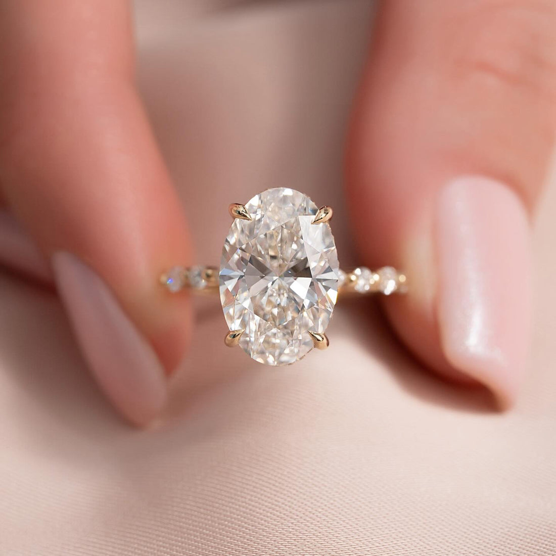 Side view of the oval lab grown diamond ring showing the hidden halo collar