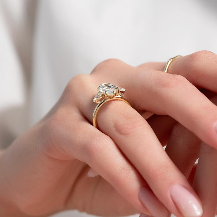 Marquise and pear star cluster diamond ring worn on hand