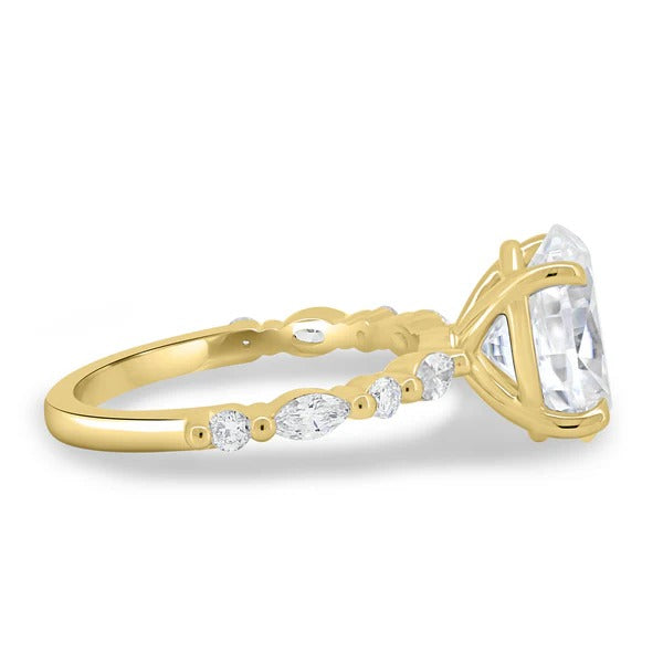 Oval diamond engagement ring with tapered accent stones on hand
