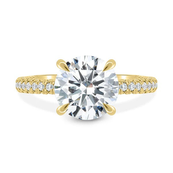Round cut lab grown diamond four claw ring with triple pave band