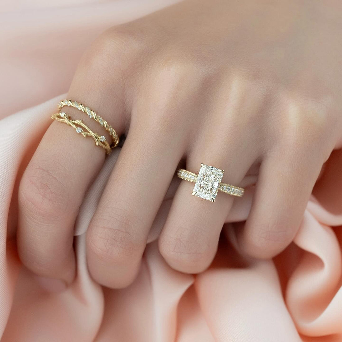 Radiant cut lab grown diamond ring with milgrain edged pave band in yellow gold