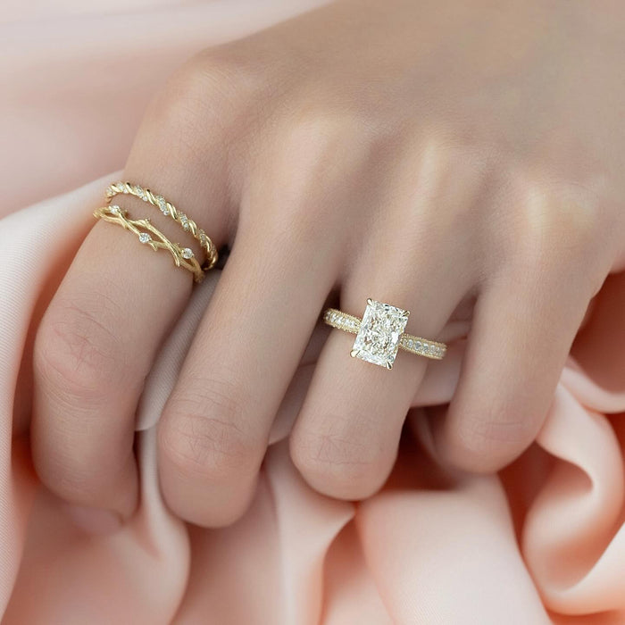 Radiant cut lab grown diamond ring with milgrain edged pave band in yellow gold