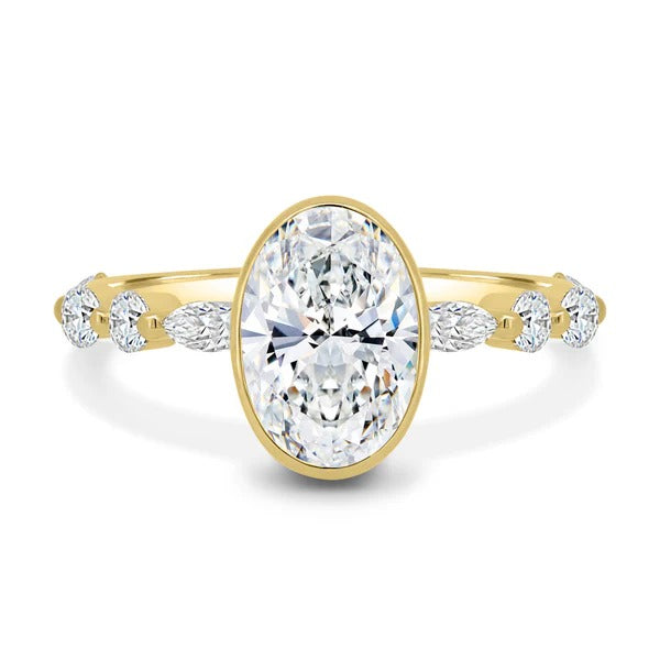 Oval cut lab grown diamond bezel ring with marquise and round accents