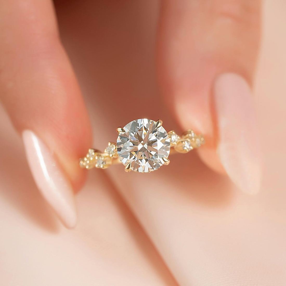 Round brilliant lab grown diamond ring with hidden halo and scattered diamond cluster band in yellow gold