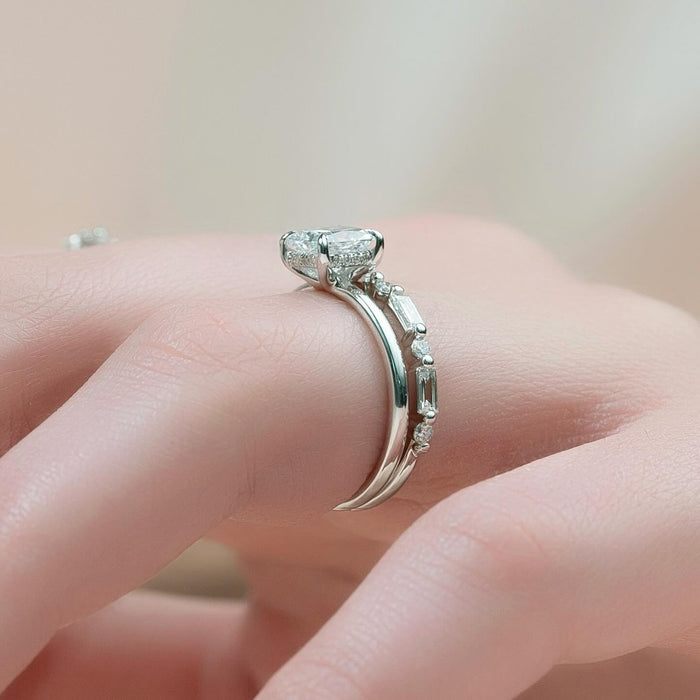 Profile of the cushion cut bridal set showing the concealed halo and the baguette band