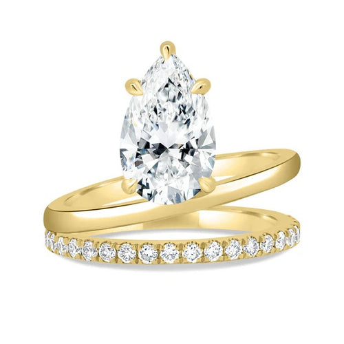 Pear cut lab grown diamond bridal ring set with pave wedding band