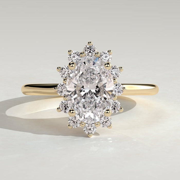 Oval cut lab grown diamond ring with an individually set halo in yellow gold