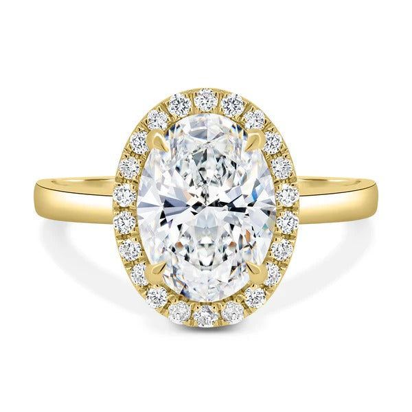 Oval cut lab grown diamond visible halo ring on a plain polished band