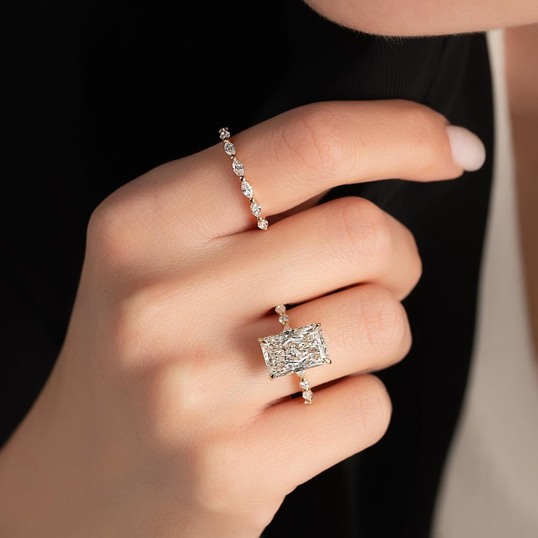 East west radiant lab grown diamond ring with marquise and round accent band in yellow gold