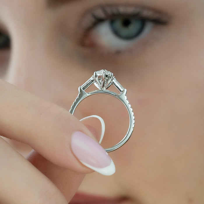 Profile of the marquise ring showing the six claws and the baguette sides