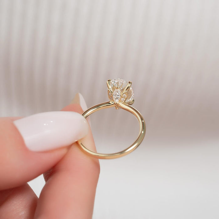 Profile showing the hidden pave halo beneath the oval diamond