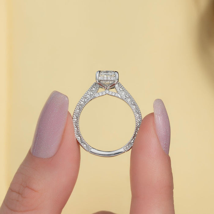 Radiant cut lab grown diamond ring showing filigree scrollwork shank and hidden halo
