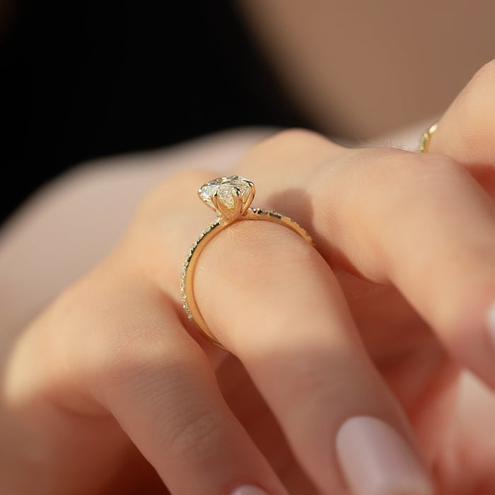 Profile of the marquise diamond ring showing the fine pave shank