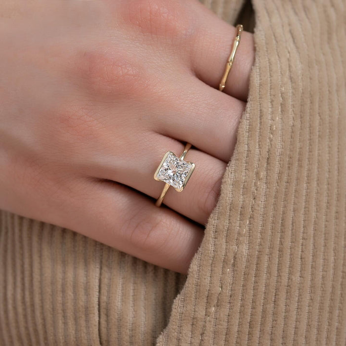 Princess cut diamond engagement ring worn on the hand