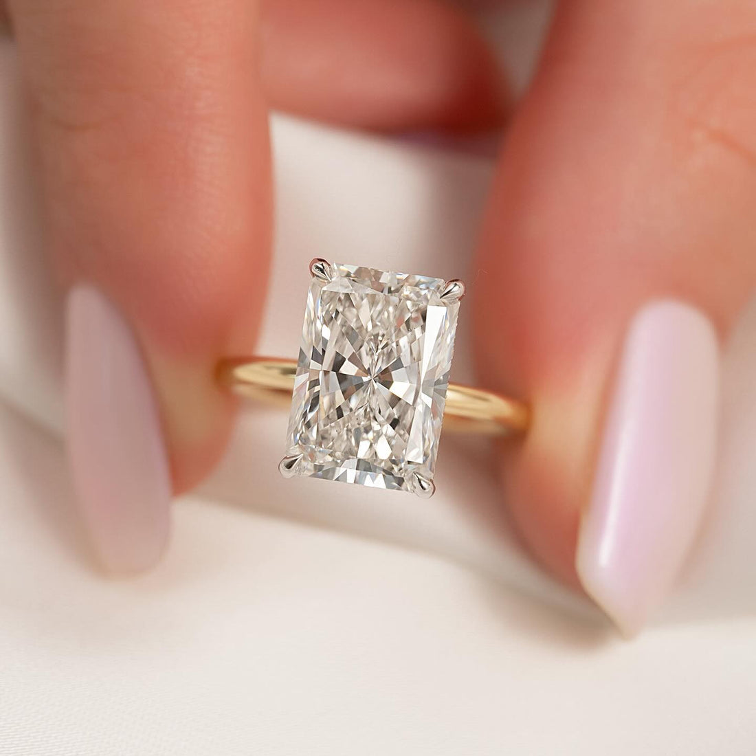 Radiant cut lab grown diamond two tone ring with white gold head and yellow gold band