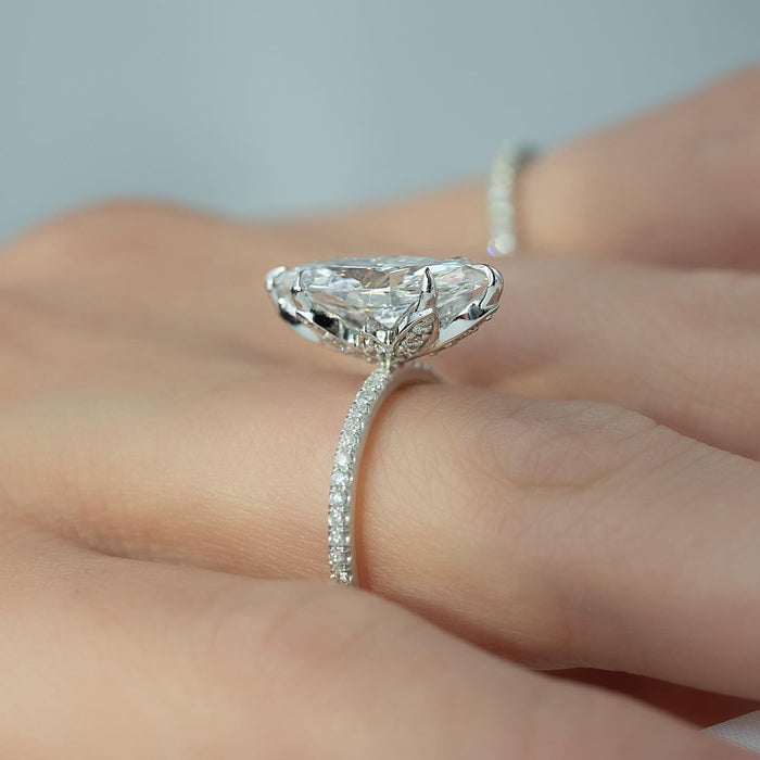 Six claw setting holding the marquise lab grown diamond