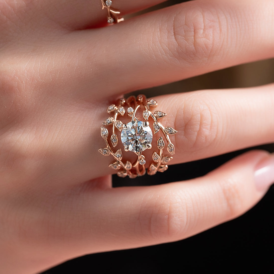 Leaf and vine lab grown diamond bridal ring set in rose gold worn on hand