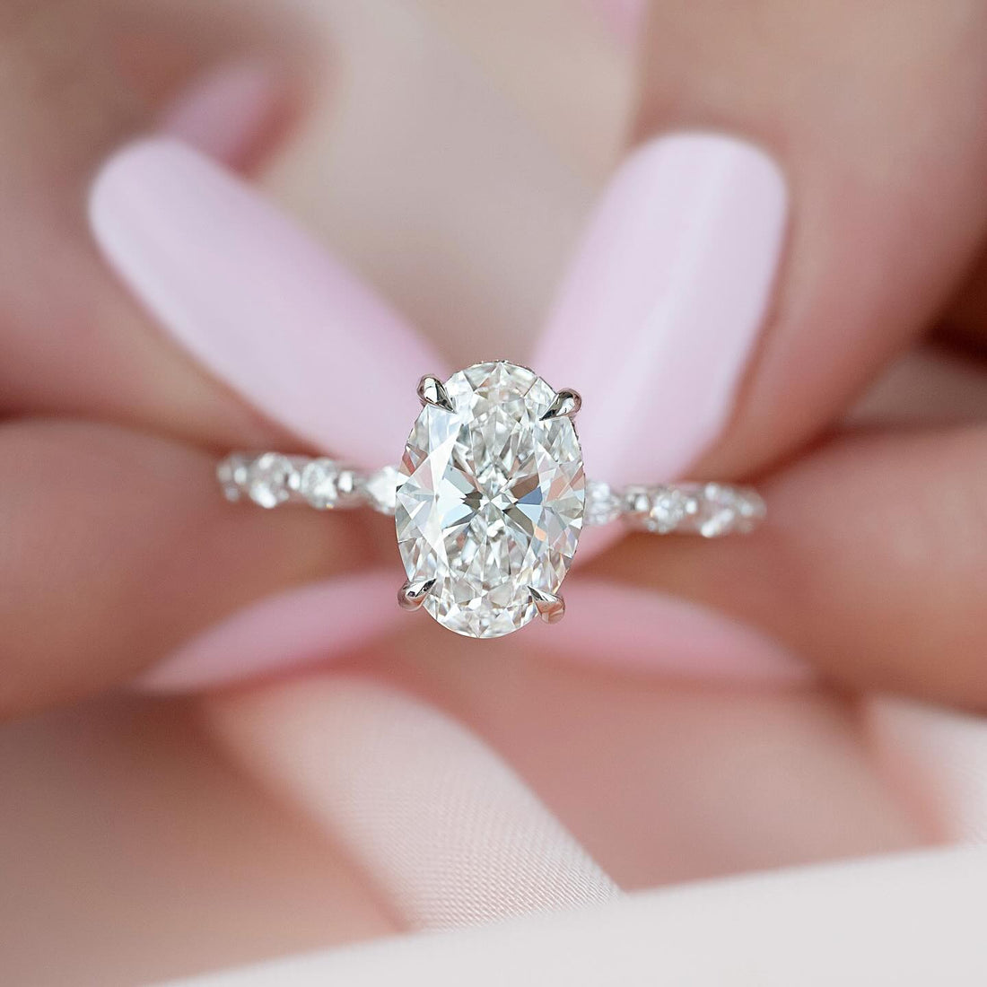 Oval cut lab grown diamond ring on a scalloped accent shank in white gold