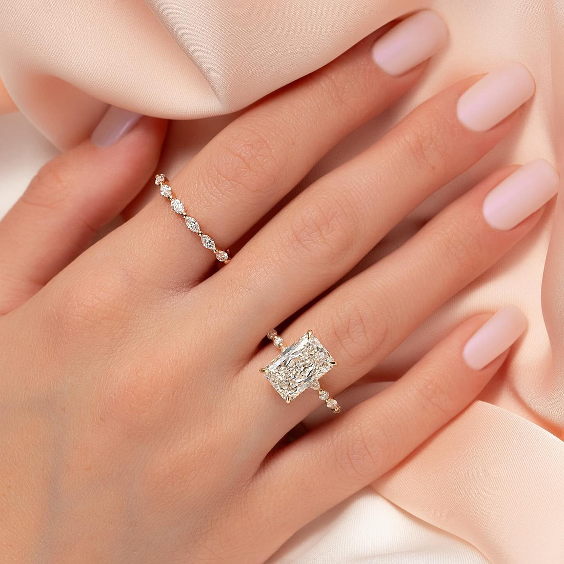Radiant cut lab grown diamond ring with spaced round accent shoulders in rose gold