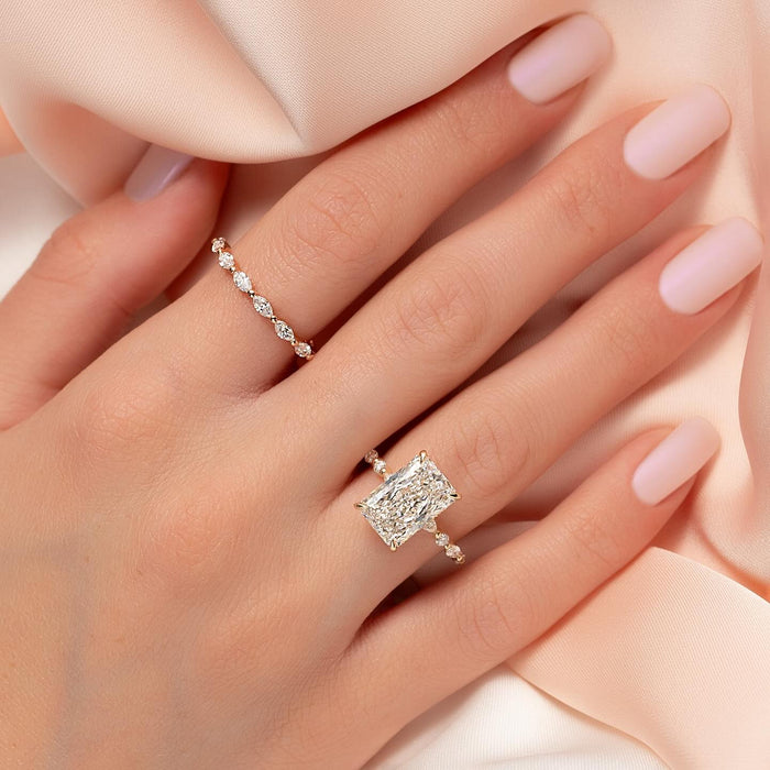 Radiant cut lab grown diamond ring with spaced round accent shoulders in rose gold