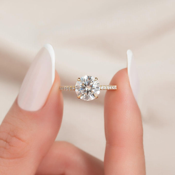 Round brilliant lab grown diamond solitaire with pave shoulders in yellow gold
