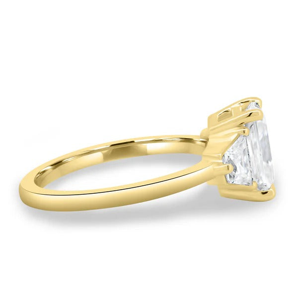 Trapezoid step cut side stones flanking radiant diamond detail