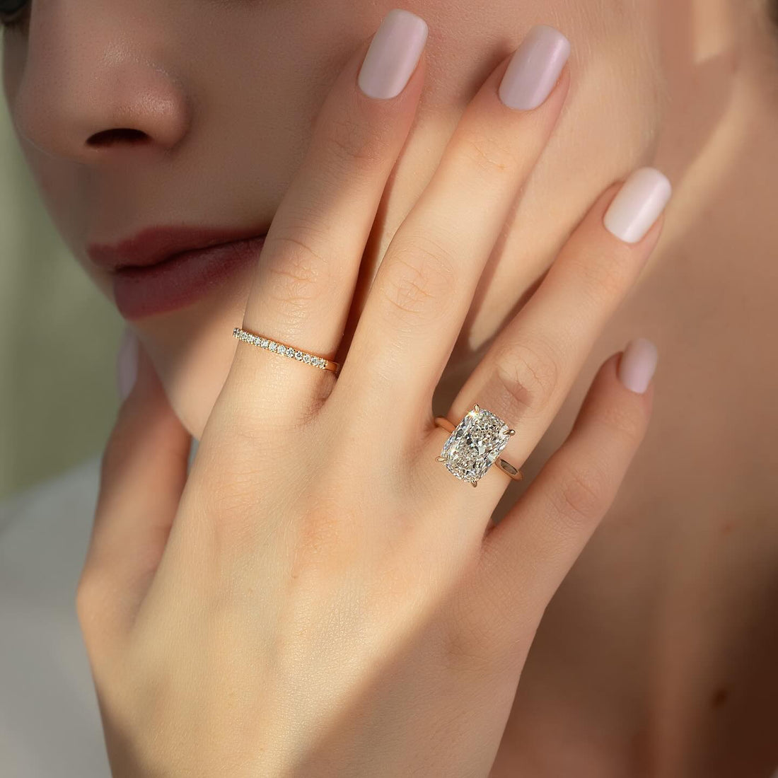Elongated cushion cut lab grown diamond solitaire ring on a plain rose gold band