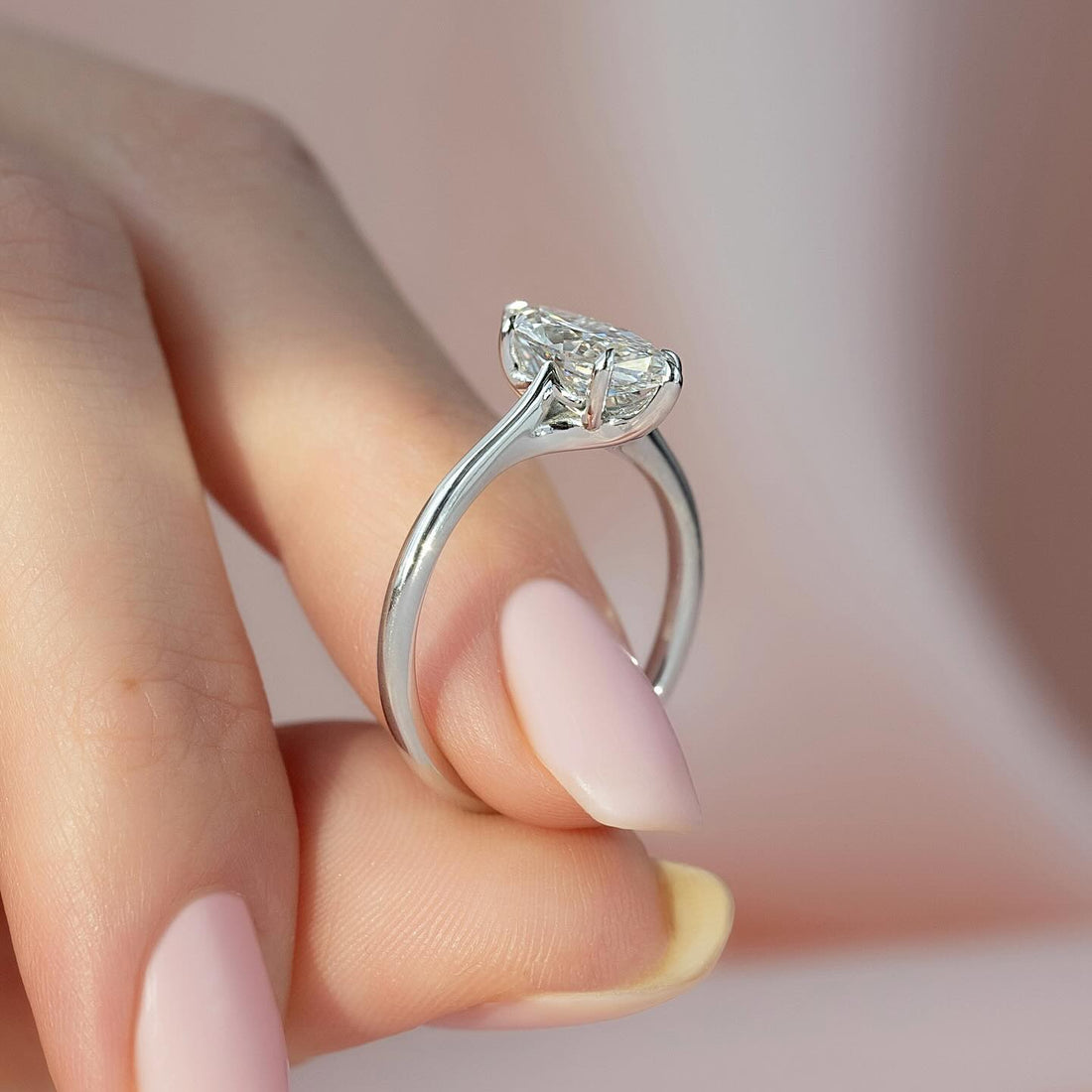Elongated cushion lab grown diamond solitaire ring on a knife edge white gold shank