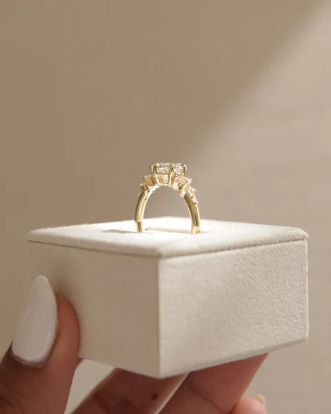 Scattered accent diamonds of varying size along the shoulders