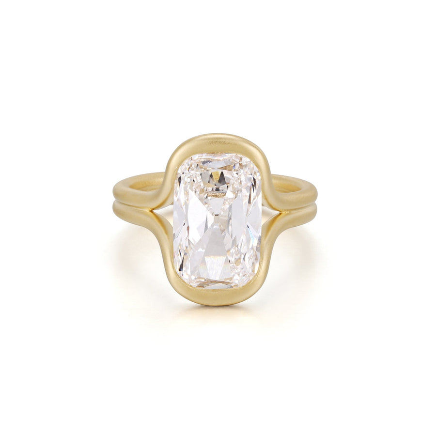 Hand view of a brushed gold double shank ring set with an old mine cut diamond