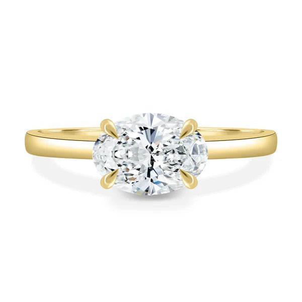 Oval cut lab grown diamond east west four claw solitaire ring
