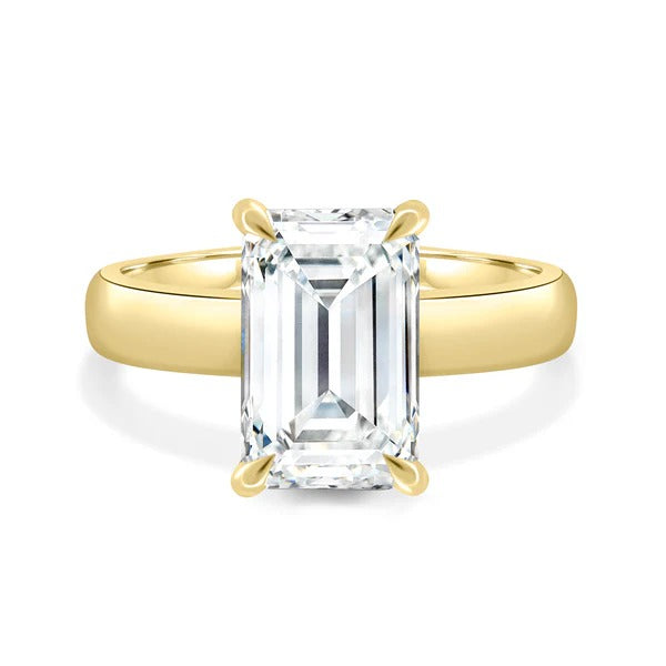 Emerald cut diamond wide gold band ring detail