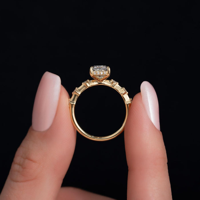 Spaced round accent station band with radiant cut centre diamond