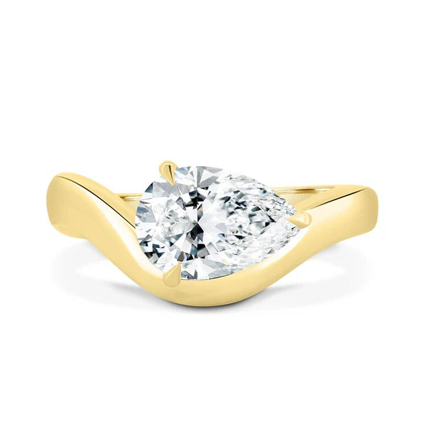 East west pear cut lab grown diamond ring in a sculpted wave band
