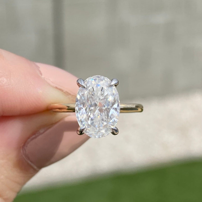 Oval cut lab grown diamond Art Deco engagement ring, angled view showing the geometric gallery