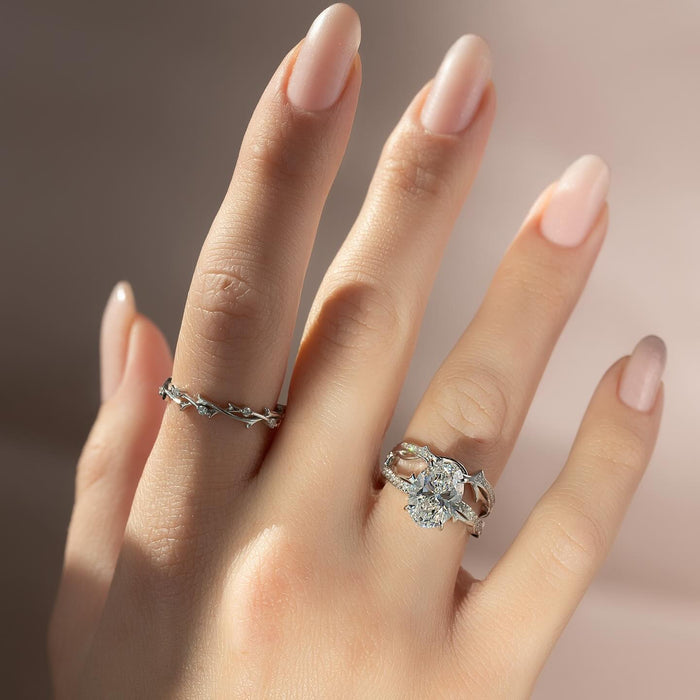Engagement ring and matching vine wedding band stacked on the finger