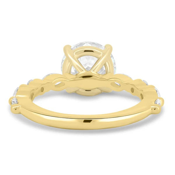 Alternating marquise and round accents spaced along the shank